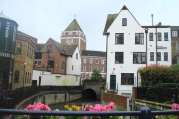 The River Hogsmill with Kingston Guildhall visible behind nearby buildings