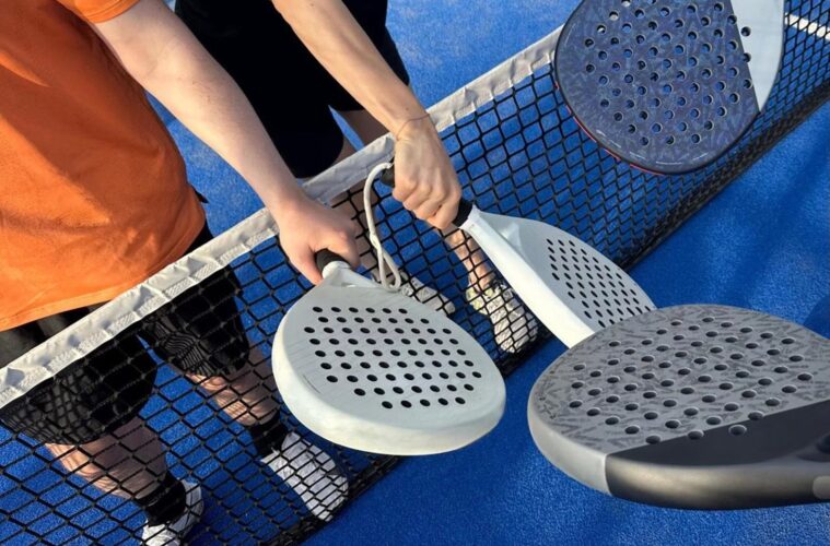 Padel rackets above a court net